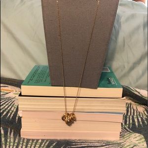 Gold colored necklace with golden rings